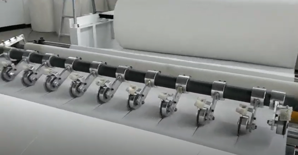 slitting and rewinding the tissue parent roll into smaller width rolls